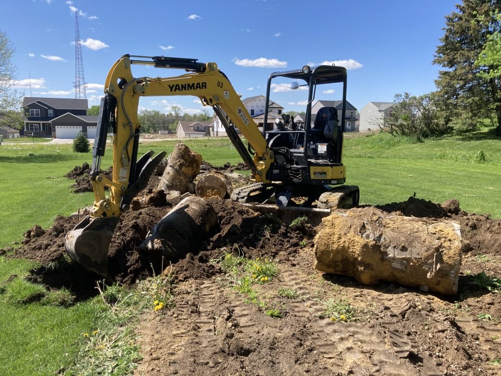 Excavator removing concrete