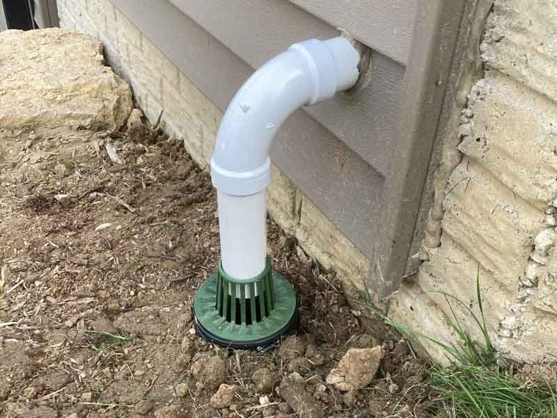 Delta-X burying a sump pump discharge line in a yard in the Quad Cities - Davenport, Iowa.