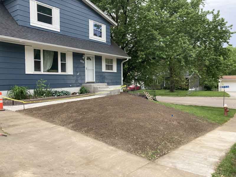 Delta-X resloping and grading front yard of house in the Quad Cities - Davenport, Iowa