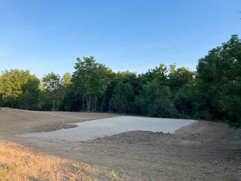 Delta-X doing dirt and gravel site work for gravel pad and driveway in the Quad Cities - Davenport, Iowa.