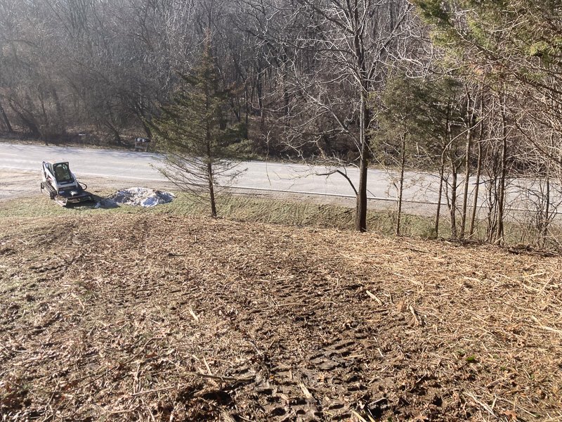 Delta-X LLC grading a swale for the water to run off properly in Davenport, Iowa.